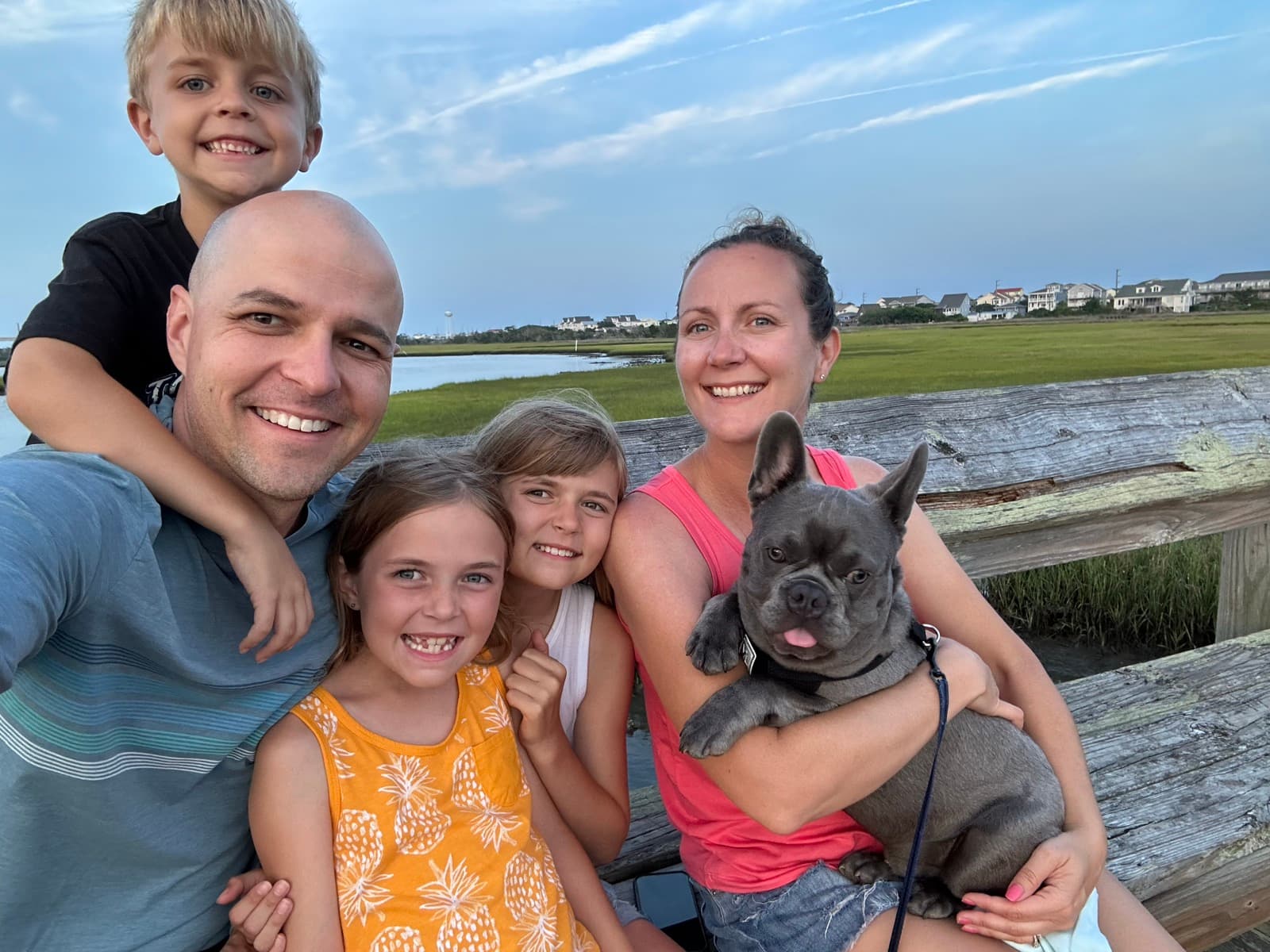 The Topsail Collection family at sunset on the sound