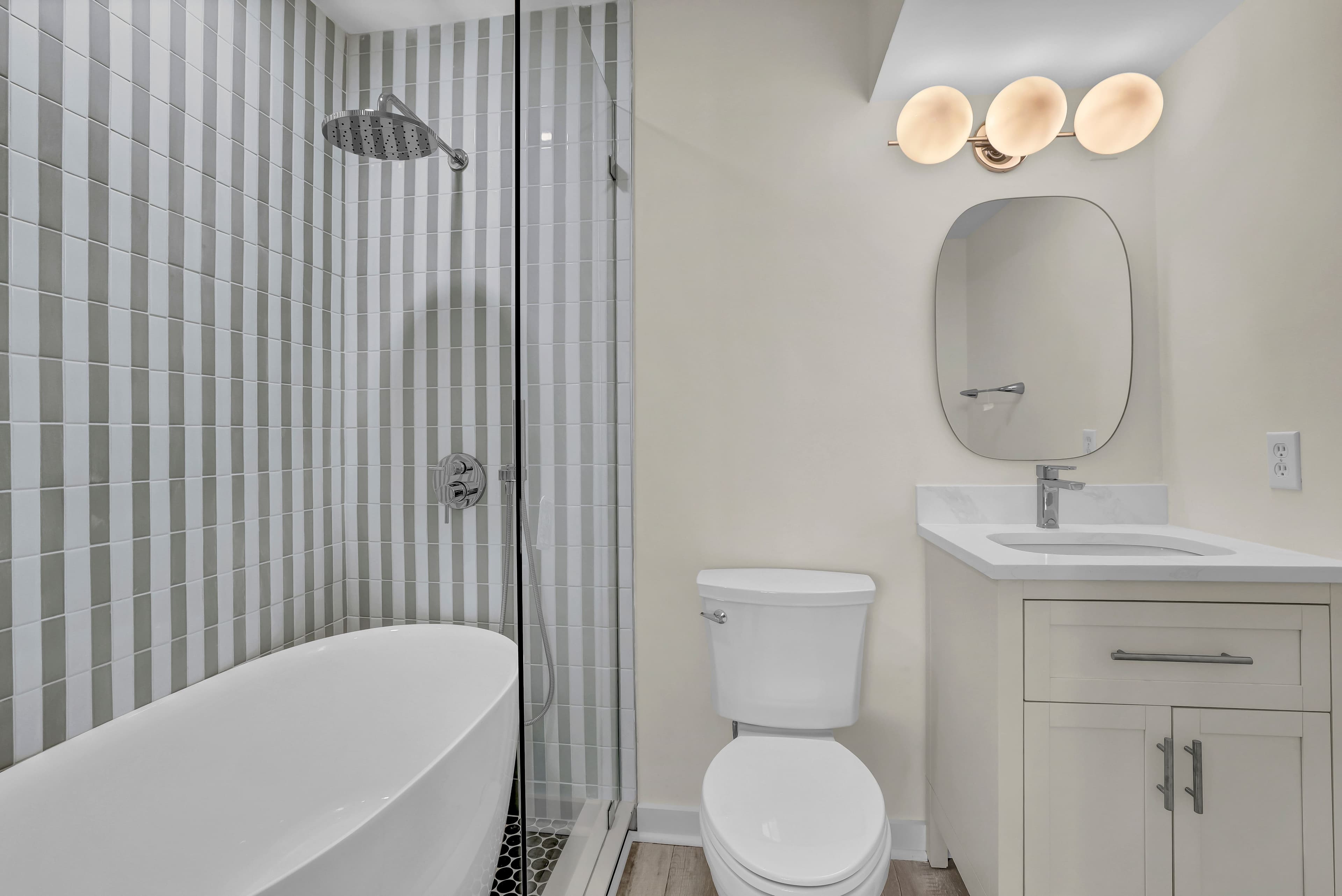 Modern spa-style bathroom with soaking tub and glass walk-in shower
