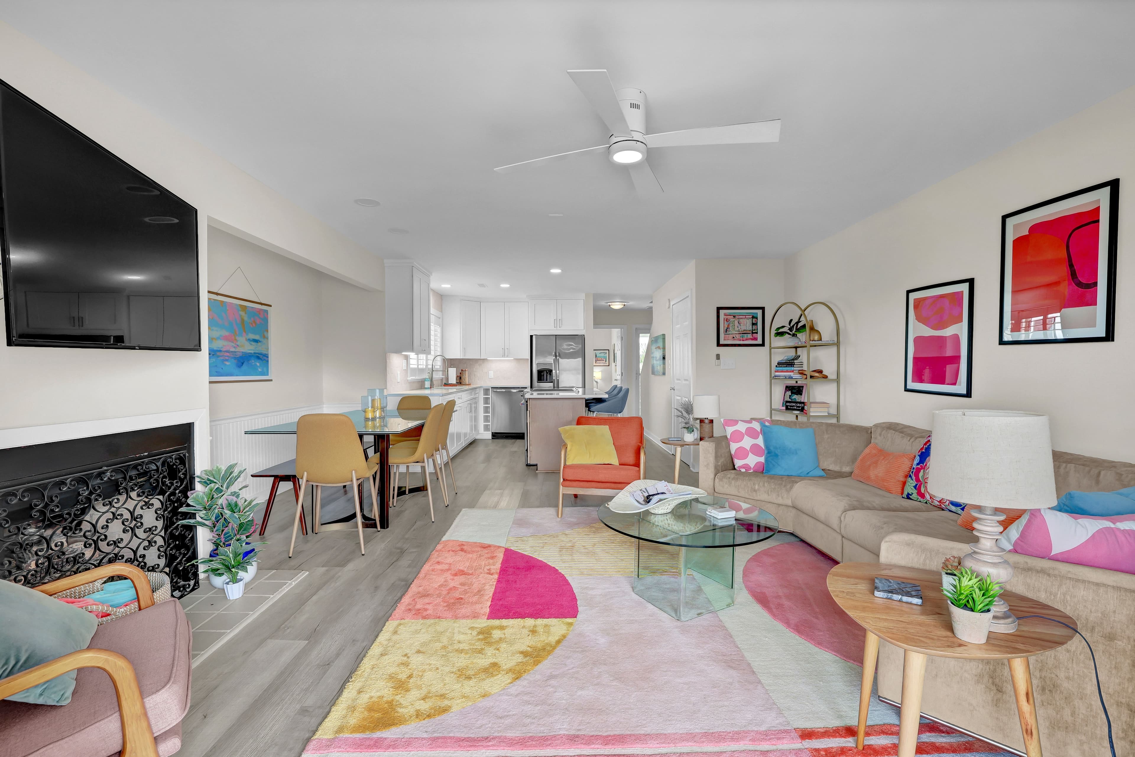 Bright open living space with colorful decor and modern kitchen
