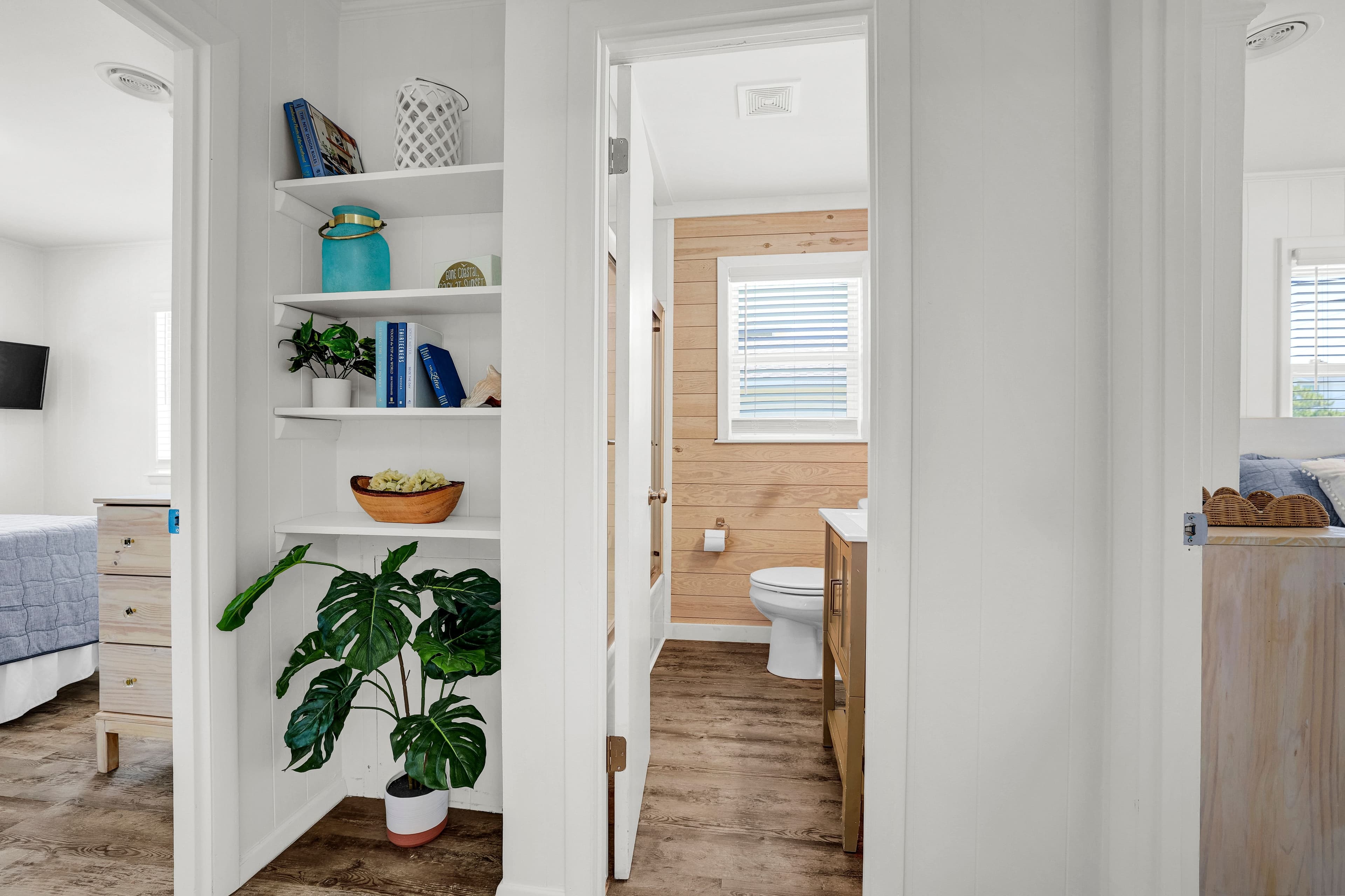 Bright hallway with stylish built-ins and a sunlit bathroom retreat